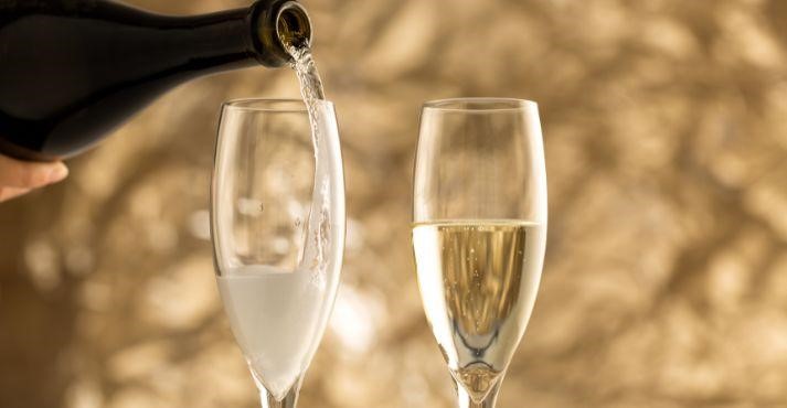 Sparkling-wine-being-poured-into-wine-glasses